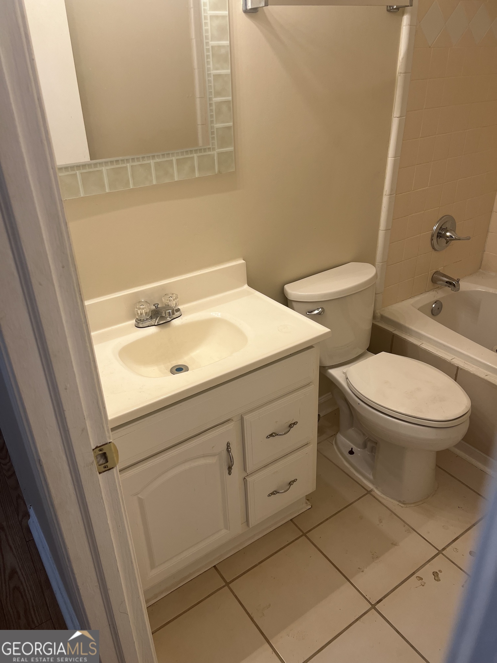 4910 Thompson Mill Road Lithonia, GA 30038 - Photo 21 of 28 a bathroom with a sink and a toilet