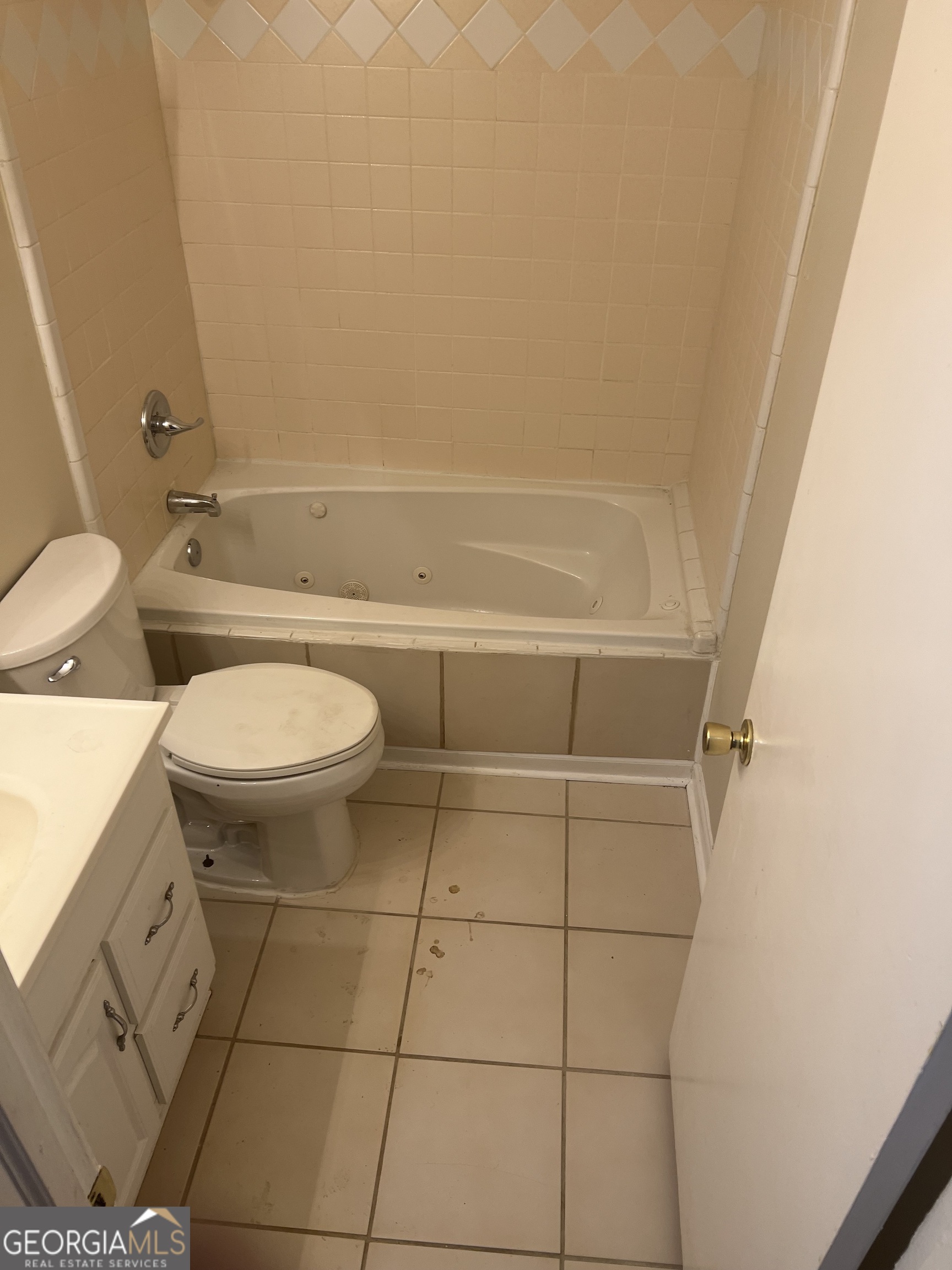 4910 Thompson Mill Road Lithonia, GA 30038 - Photo 22 of 28 a bathroom with a sink and a toilet
