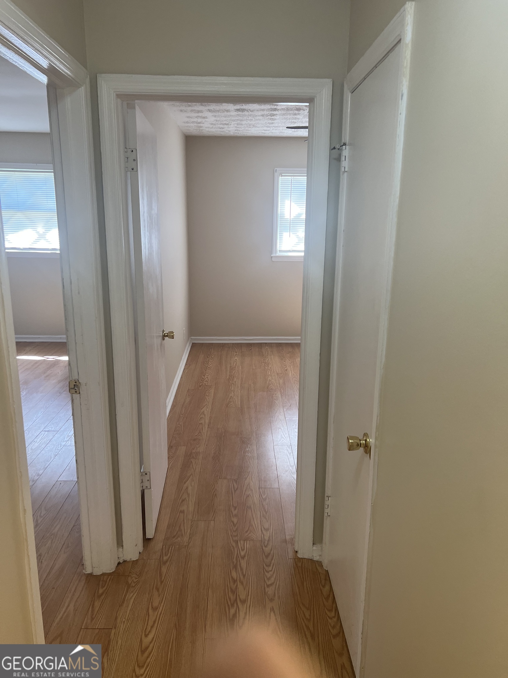 4910 Thompson Mill Road Lithonia, GA 30038 - Photo 23 of 28 a view of a hallway with wooden floor