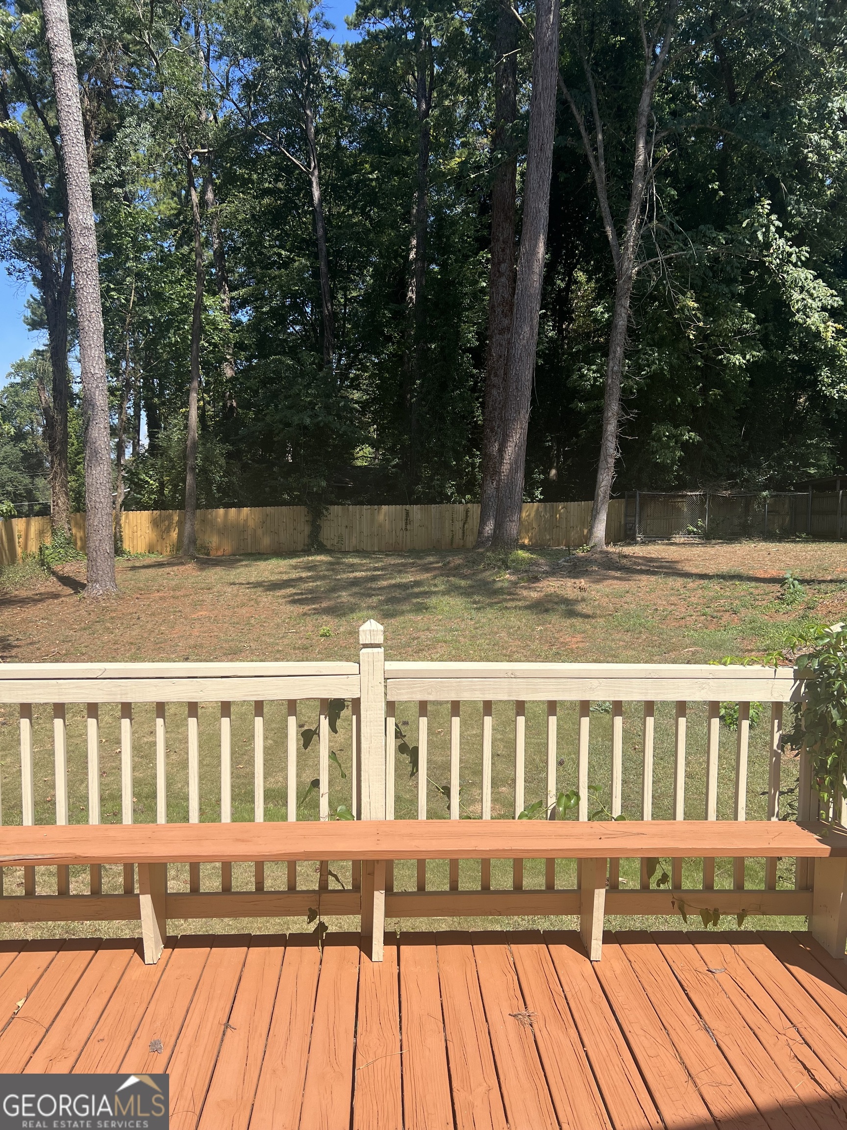 4910 Thompson Mill Road Lithonia, GA 30038 - Photo 4 of 28 a view of a house with backyard and sitting area