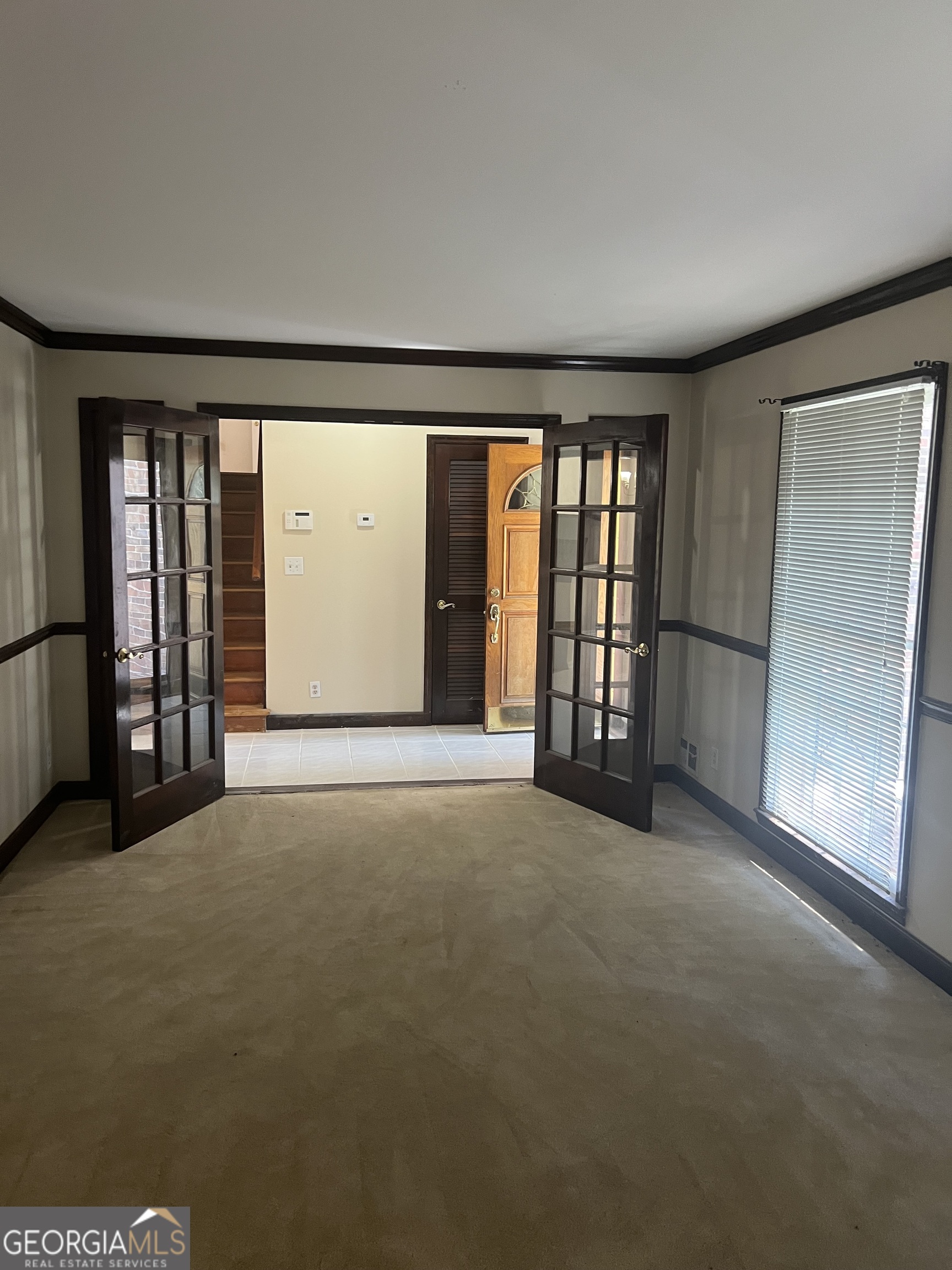 4910 Thompson Mill Road Lithonia, GA 30038 - Photo 7 of 28 an empty room with windows