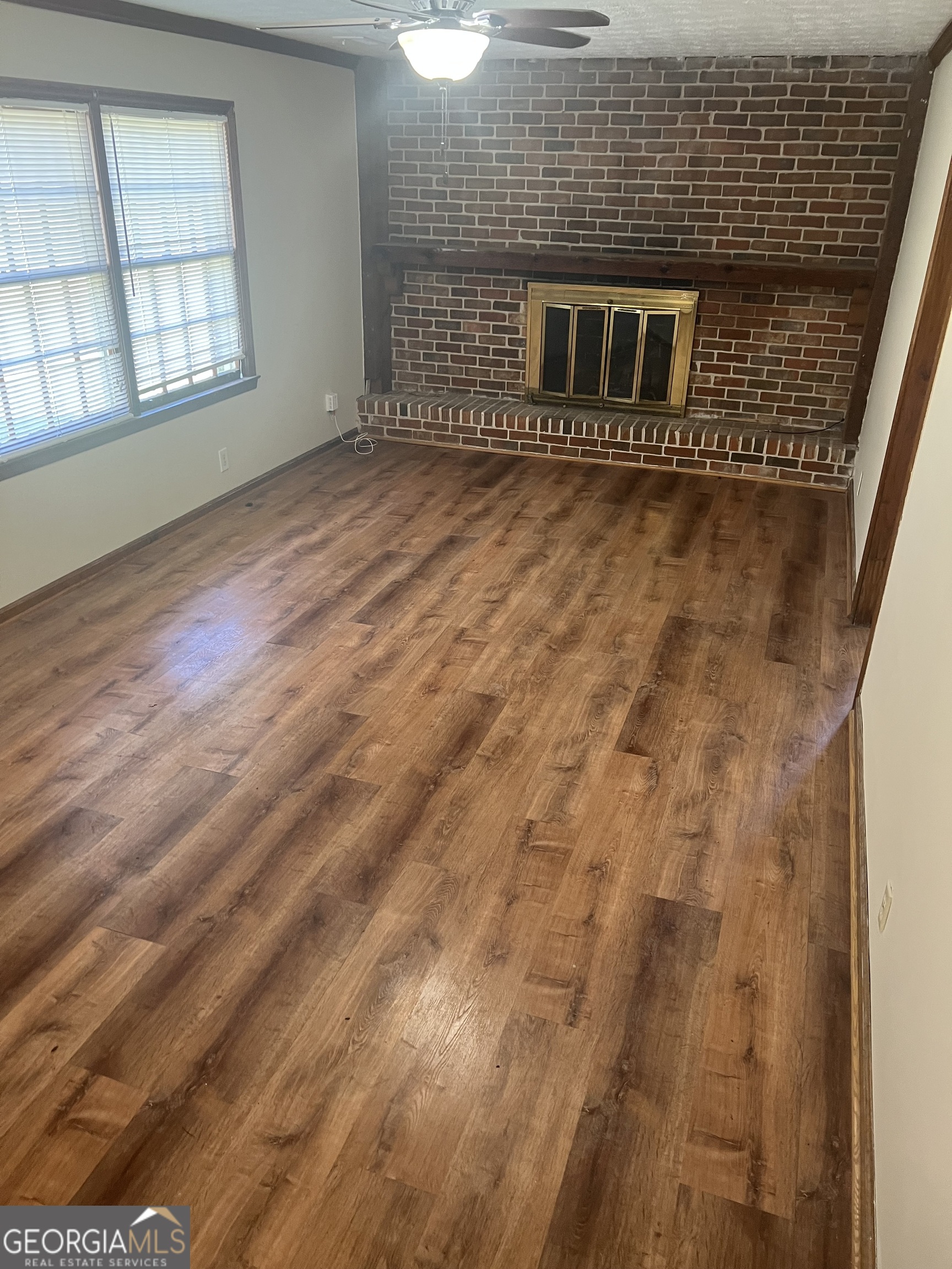 4910 Thompson Mill Road Lithonia, GA 30038 - Photo 10 of 28 a view of an empty room with windows