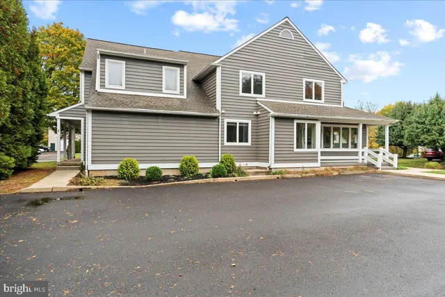 a front view of a house with yard