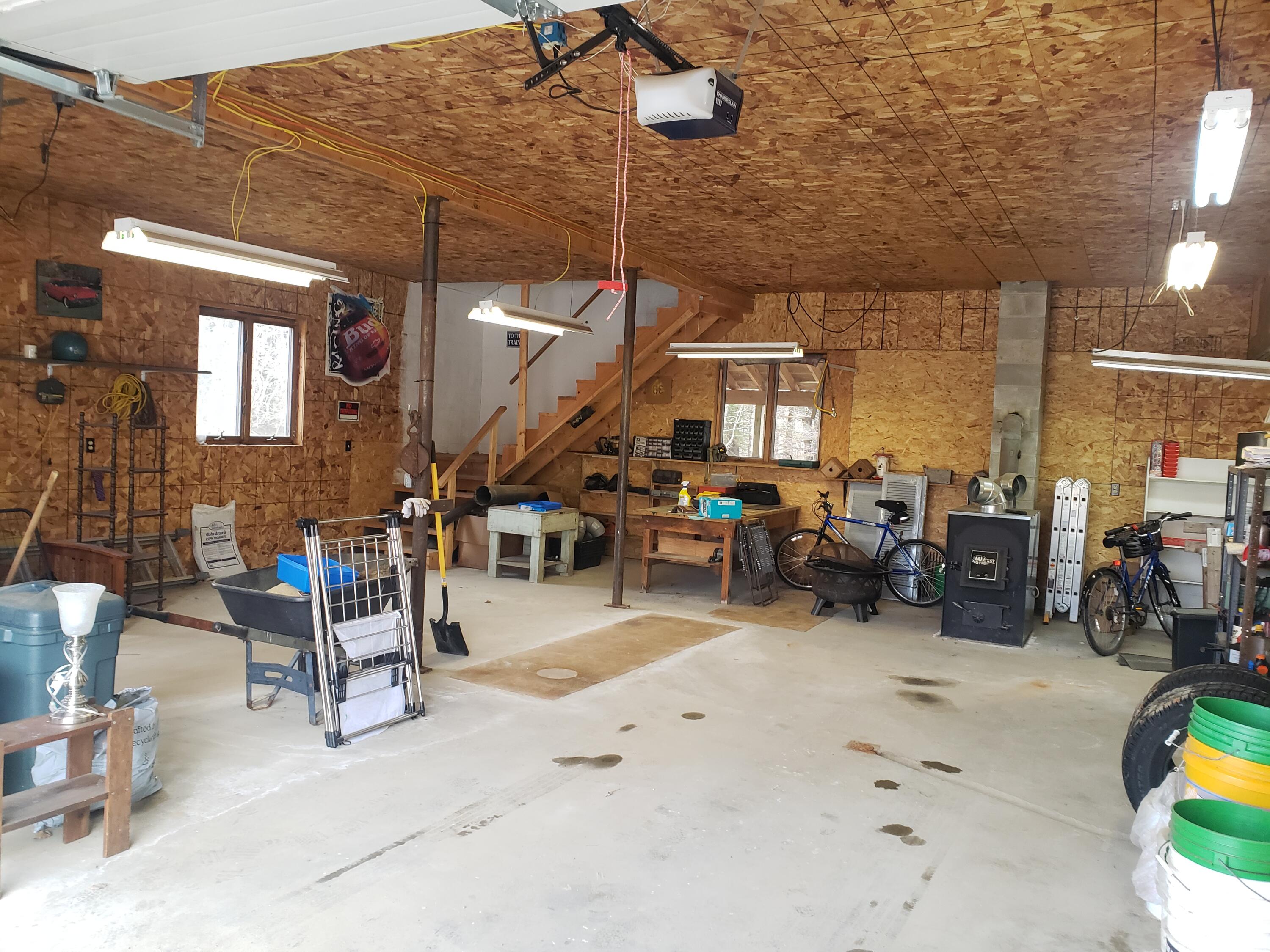 39 Winkumpaugh Road Orland, ME 04472 - Photo 55 of 57 Main part of garage with 2 OH doors