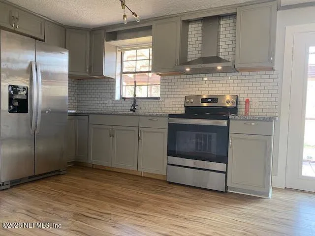 a view of a yard with cars