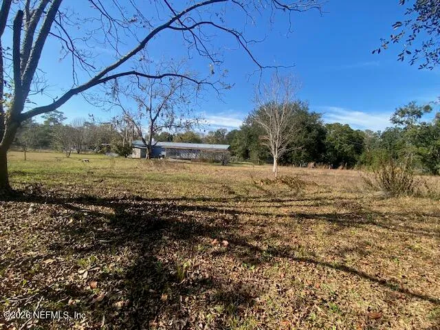 a backyard of a house with lots of green space