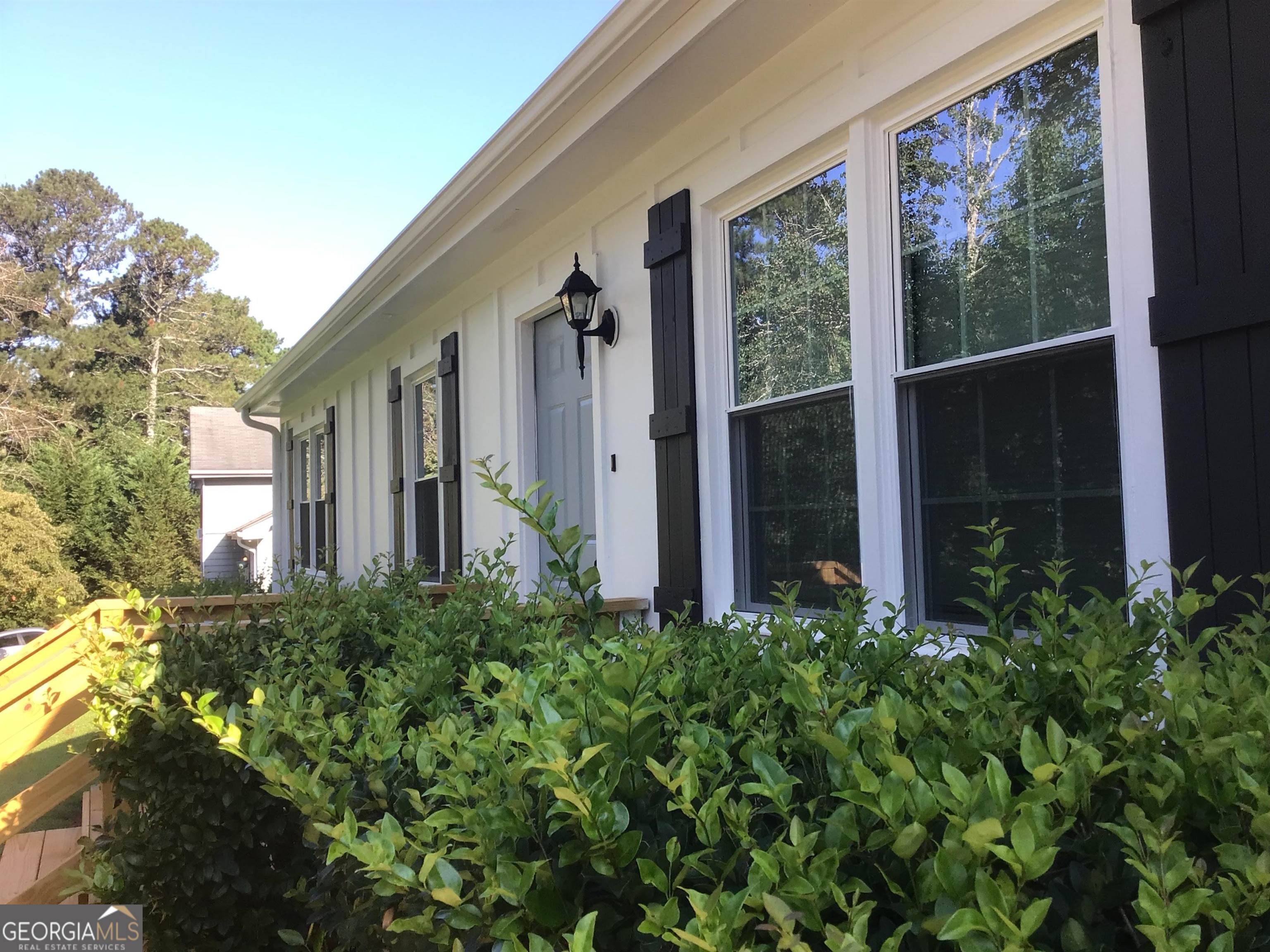 a view of a house with balcony and garden