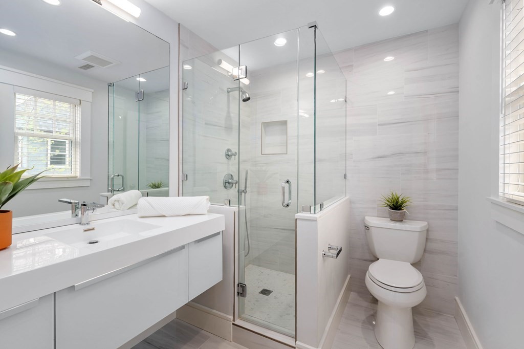 154 Spring Street, Unit 154 Watertown, MA 02472 - Photo 17 of 27 a bathroom with a sink toilet and shower