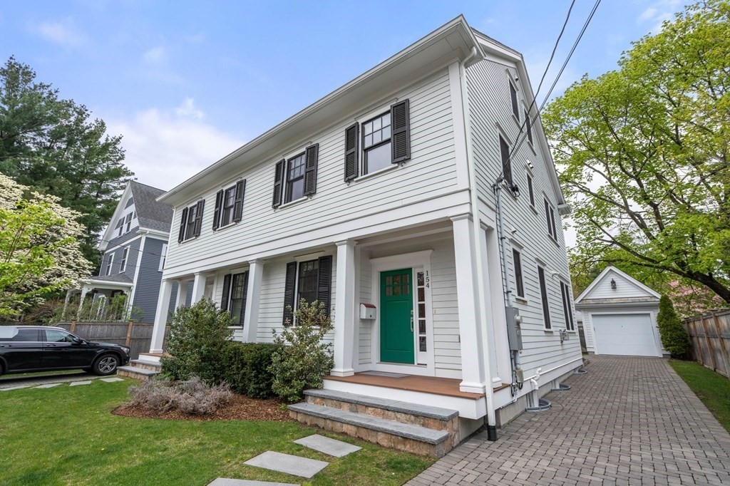 154 Spring Street, Unit 154 Watertown, MA 02472 - Photo 2 of 27 a front view of a house with a yard