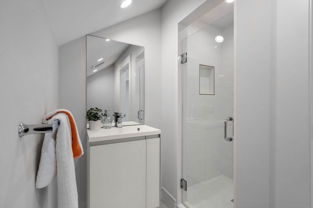 154 Spring Street, Unit 154 Watertown, MA 02472 - Photo 22 of 27 a bathroom with a sink a toilet and shower