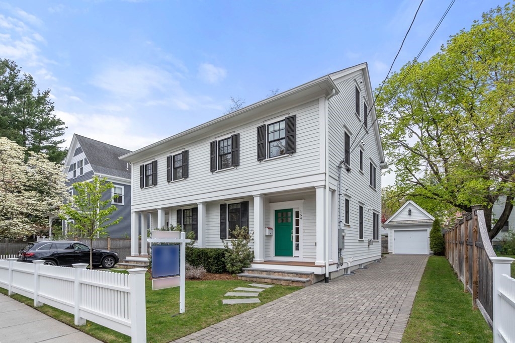 154 Spring Street, Unit 154 Watertown, MA 02472 - Photo 4 of 27 a front view of a house with yard and green space
