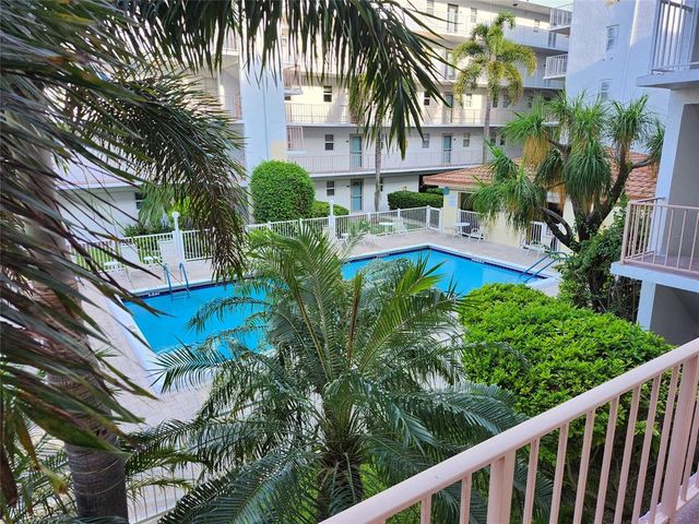 a view of a backyard with a garden and plants