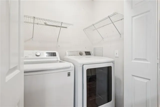 an aerial view of house with yard and mountain view in back