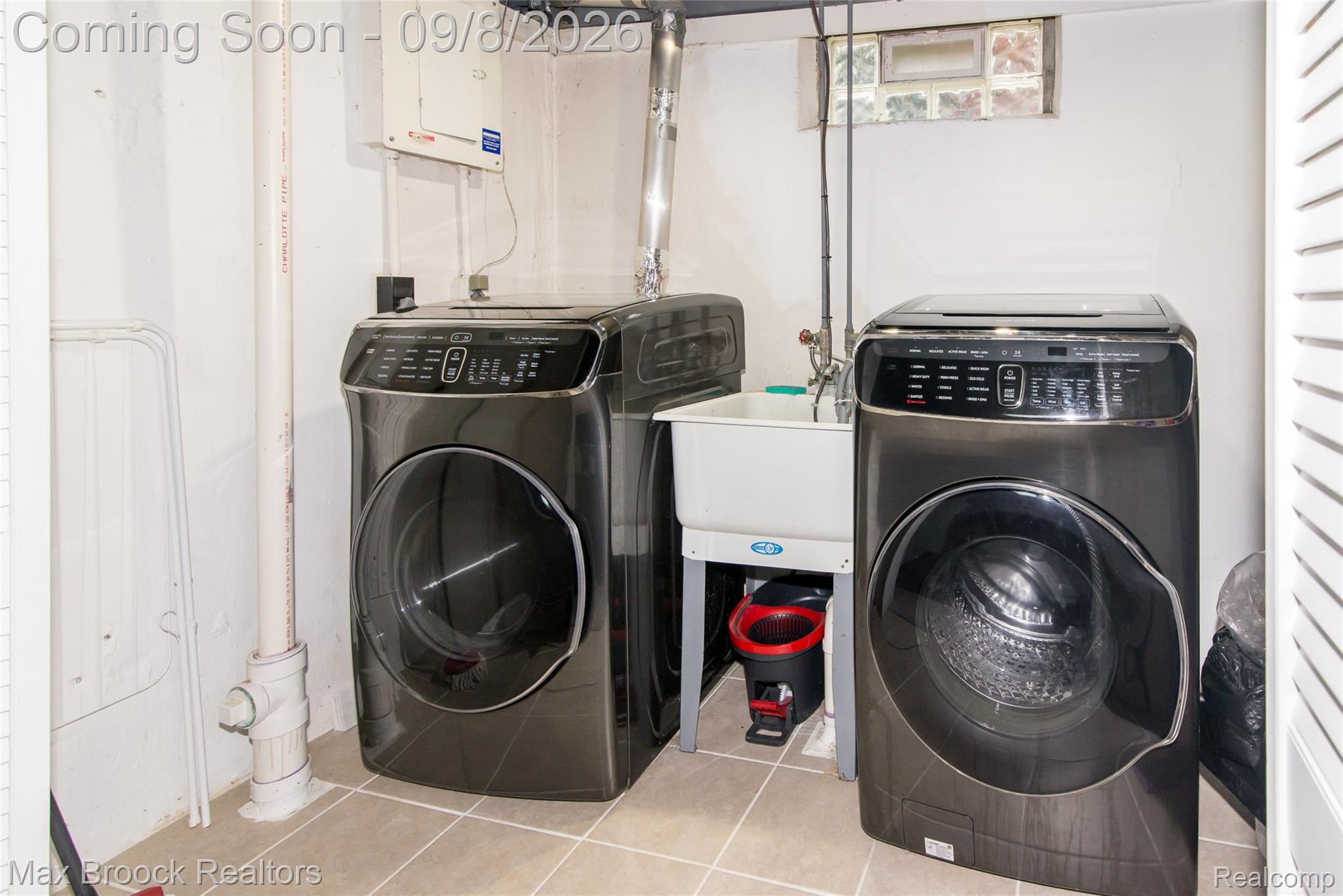 1533 Mansfield Road Birmingham, MI 48009 - Photo 34 of 48 Dedicated laundry area featuring a utility sink and a window