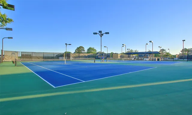 a view of an outdoor space and tennis court