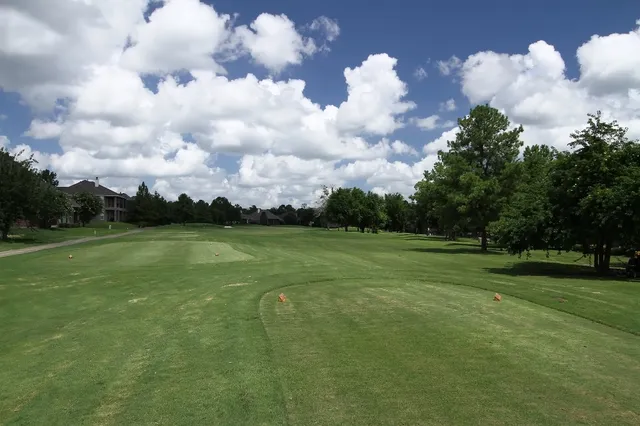 a view of a golf course with a big yard