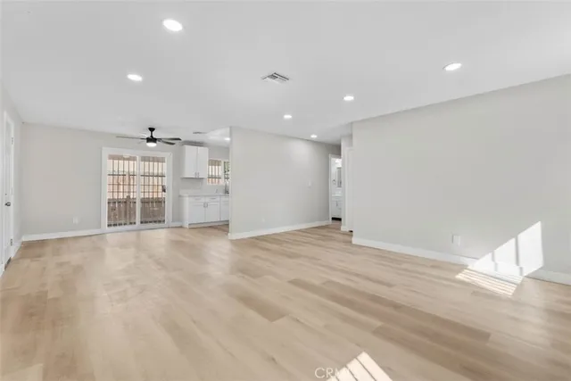 a view of a kitchen with a sink and a large window
