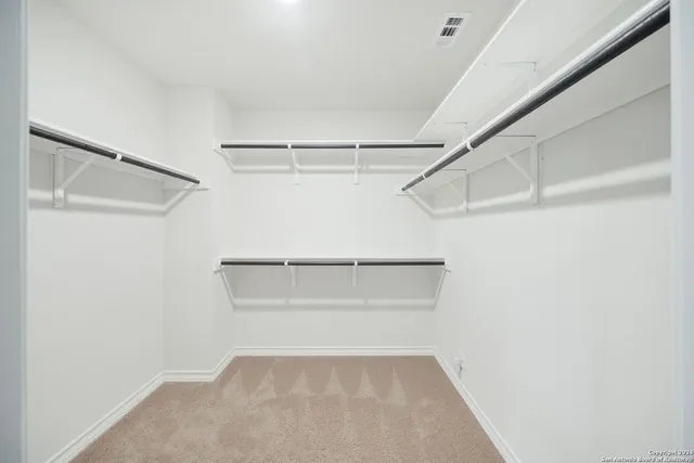 a view of an empty walk in closet
