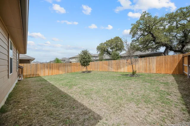 a view of a backyard with lake view