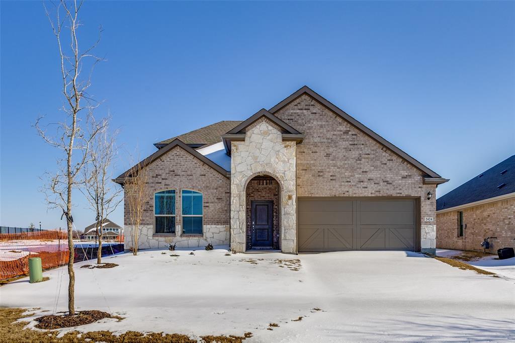 Striking new-construction exterior with beautiful front elevation with inviting entry.