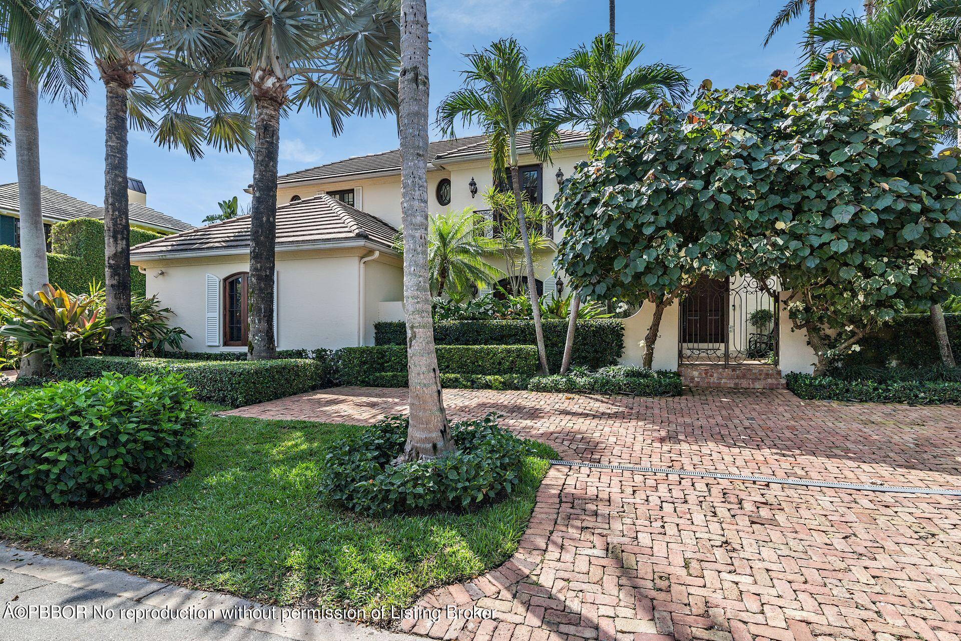 250 Country Club Road Palm Beach, FL 33480 - Photo 1 of 33 a front view of a house with garden