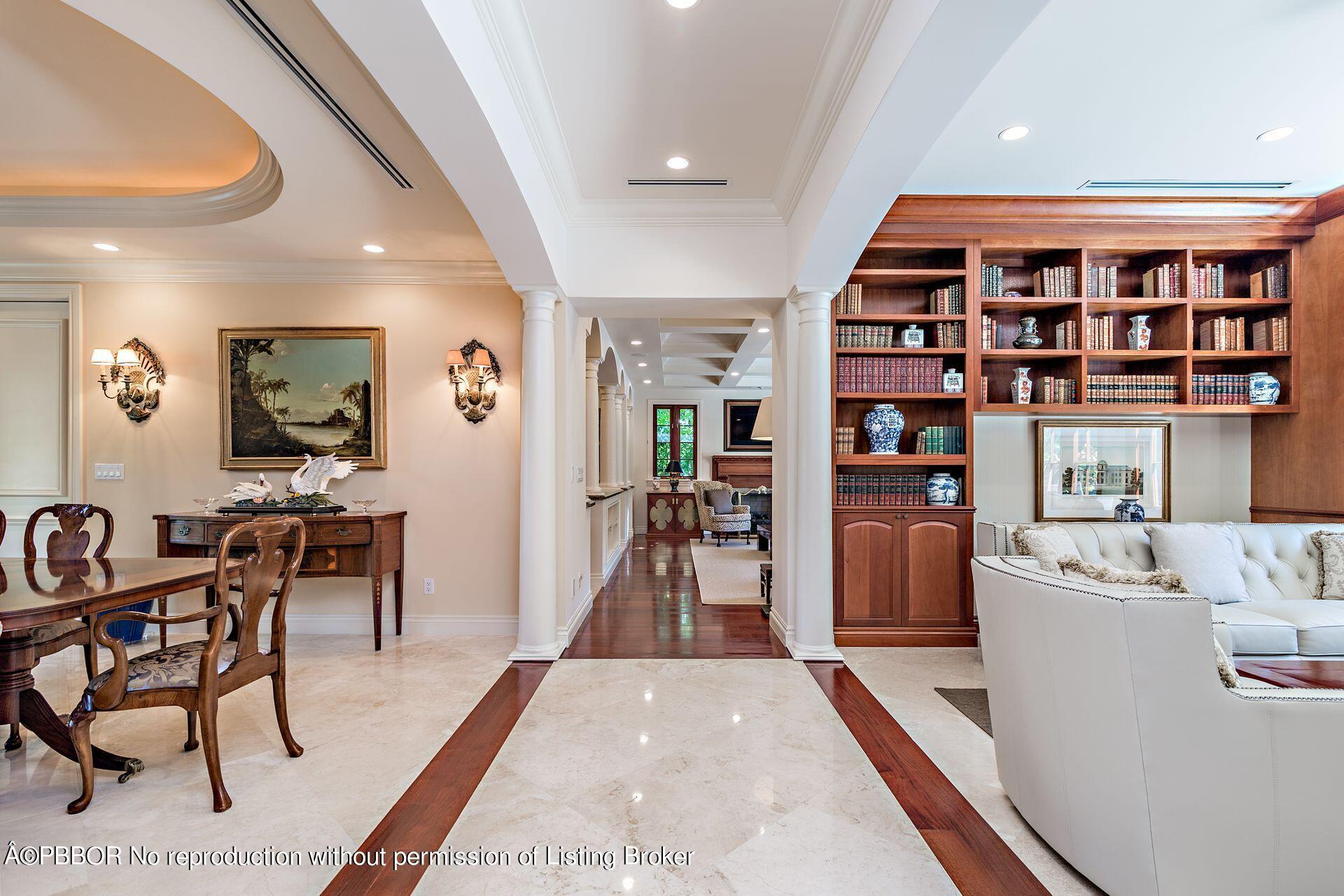 250 Country Club Road Palm Beach, FL 33480 - Photo 14 of 33 a living room with furniture and a book shelf