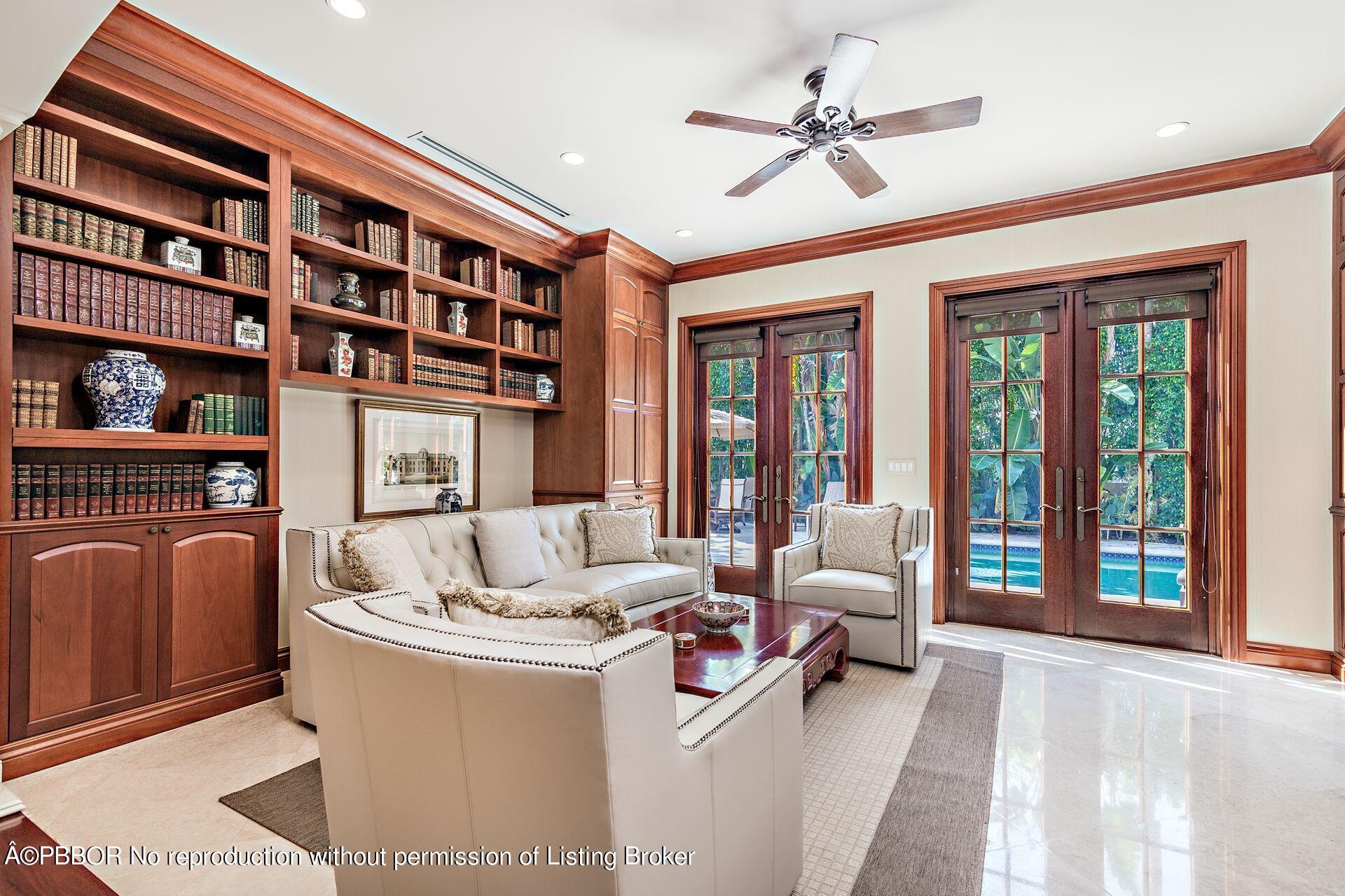 250 Country Club Road Palm Beach, FL 33480 - Photo 15 of 33 a living room with furniture and floor to ceiling windows