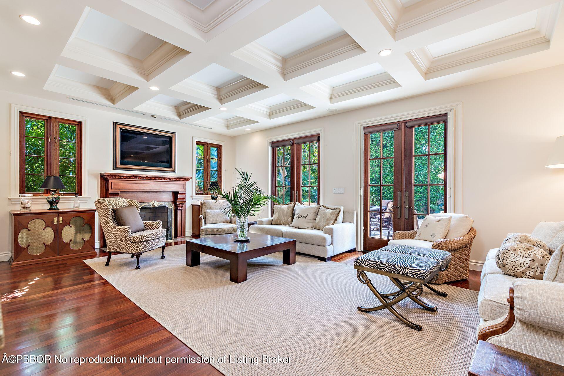 250 Country Club Road Palm Beach, FL 33480 - Photo 16 of 33 a living room with furniture flat screen tv and a large window
