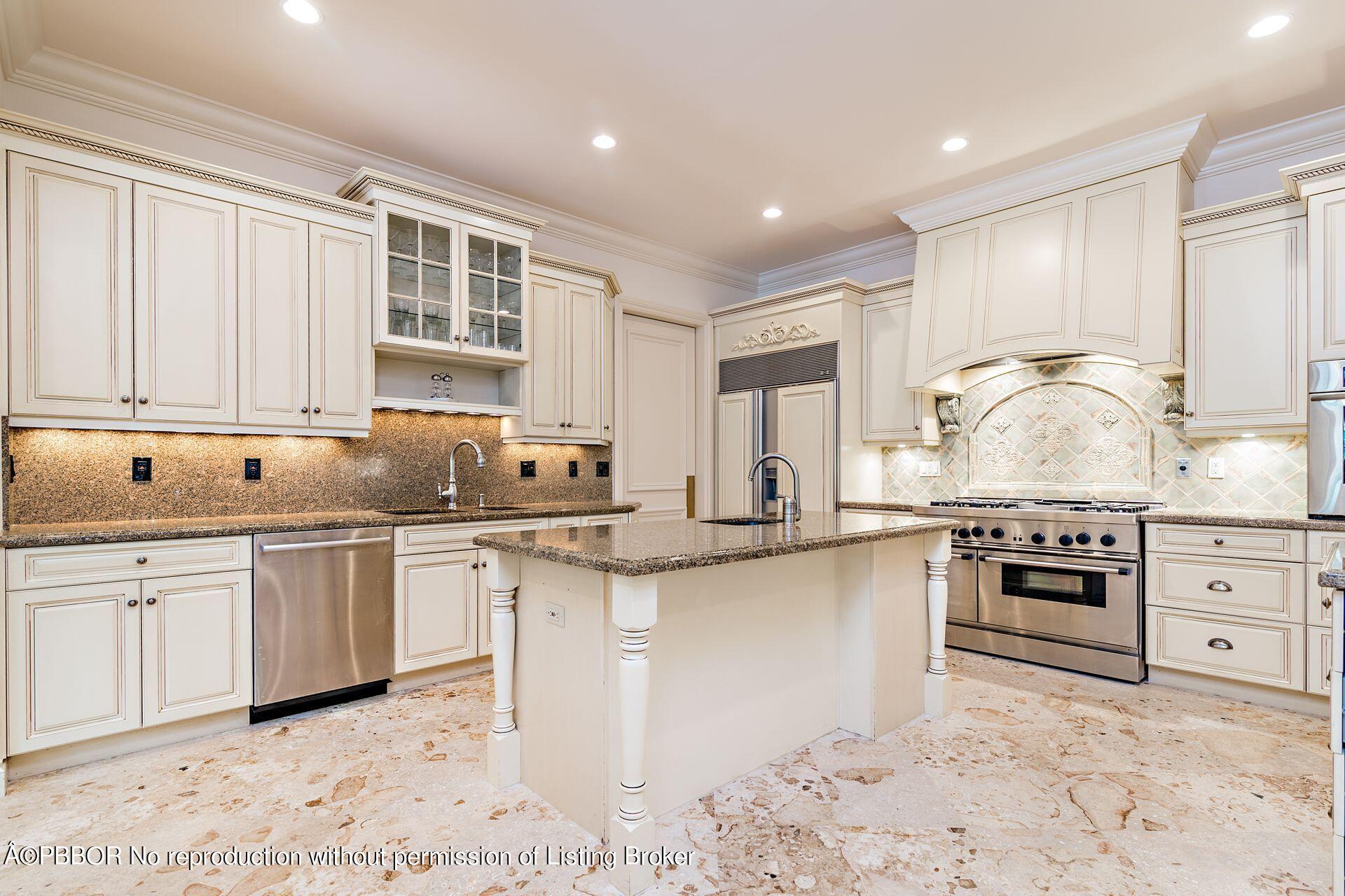 250 Country Club Road Palm Beach, FL 33480 - Photo 18 of 33 a kitchen with stainless steel appliances granite countertop a stove a sink and a microwave