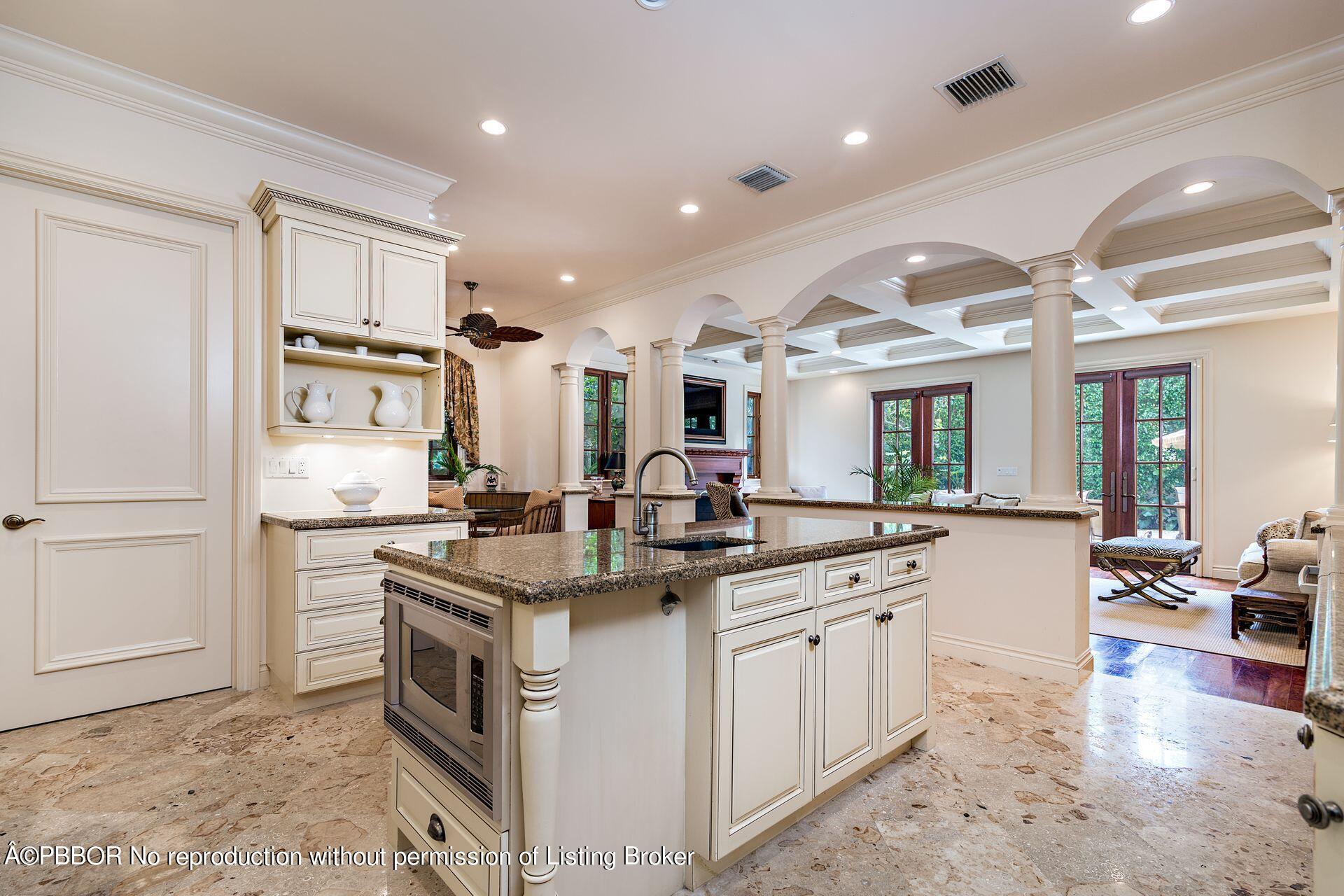 250 Country Club Road Palm Beach, FL 33480 - Photo 19 of 33 a kitchen with stainless steel appliances granite countertop a sink stove and refrigerator