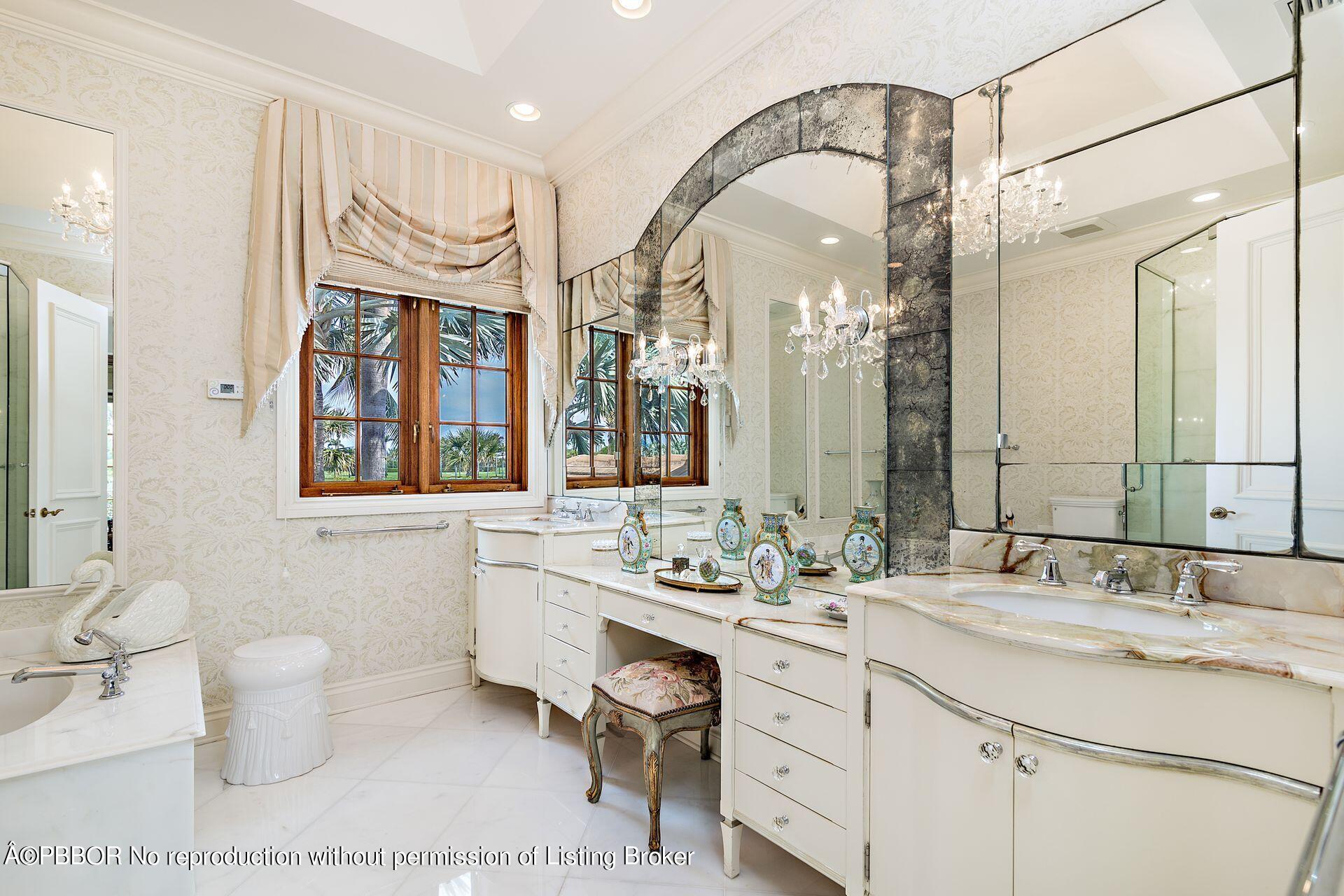 250 Country Club Road Palm Beach, FL 33480 - Photo 20 of 33 a bathroom with a sink a toilet and a mirror