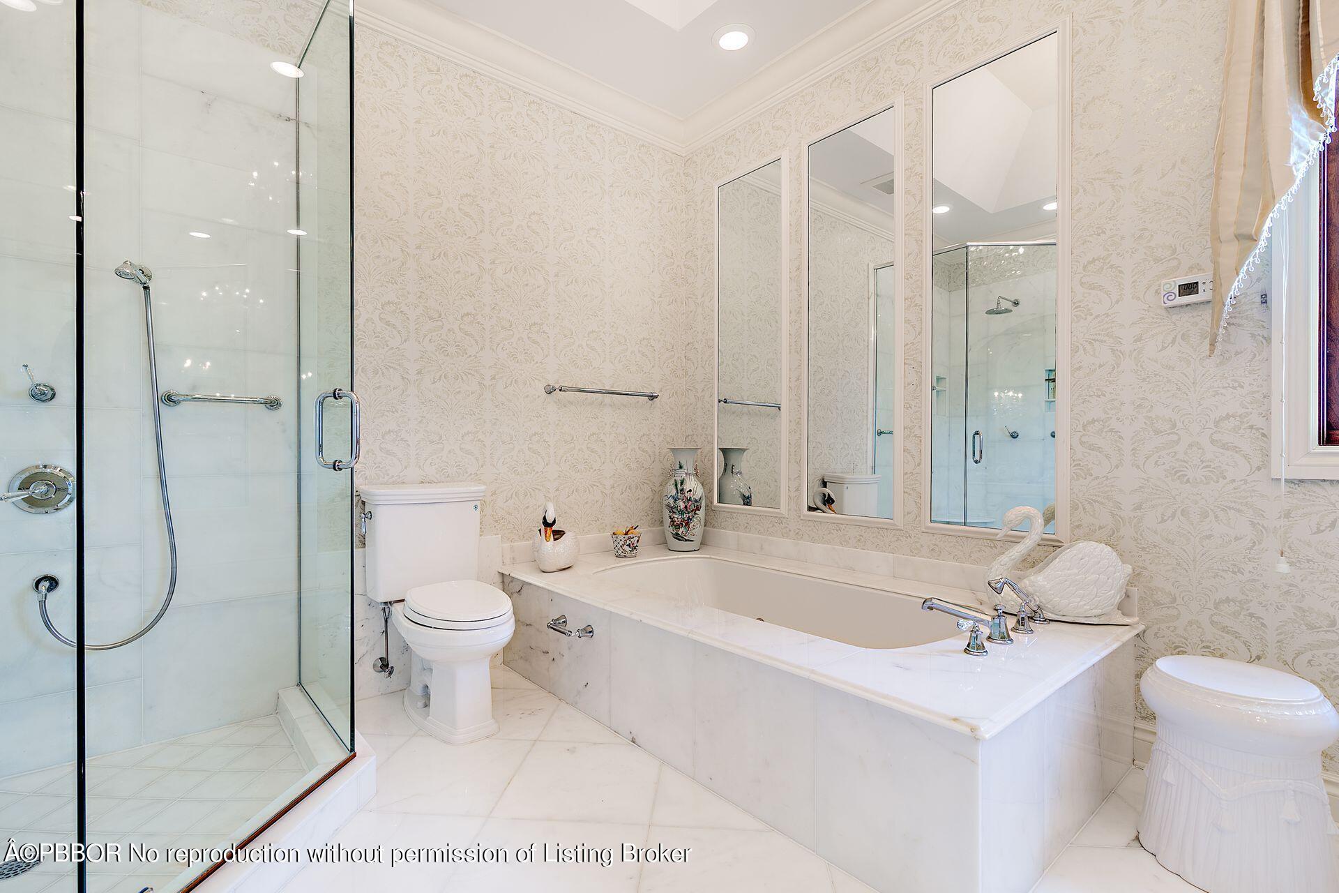 250 Country Club Road Palm Beach, FL 33480 - Photo 21 of 33 a bathroom with a bathtub shower sink mirror and toilet