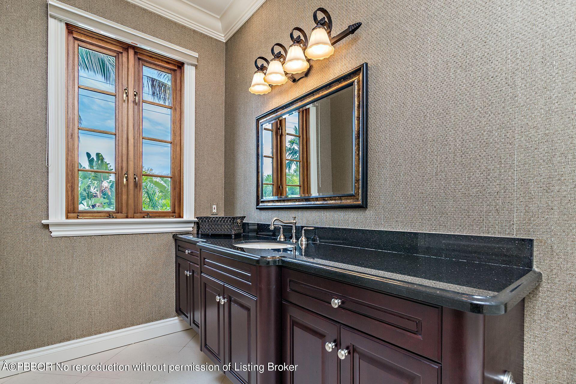 250 Country Club Road Palm Beach, FL 33480 - Photo 22 of 33 a kitchen with a sink and a window