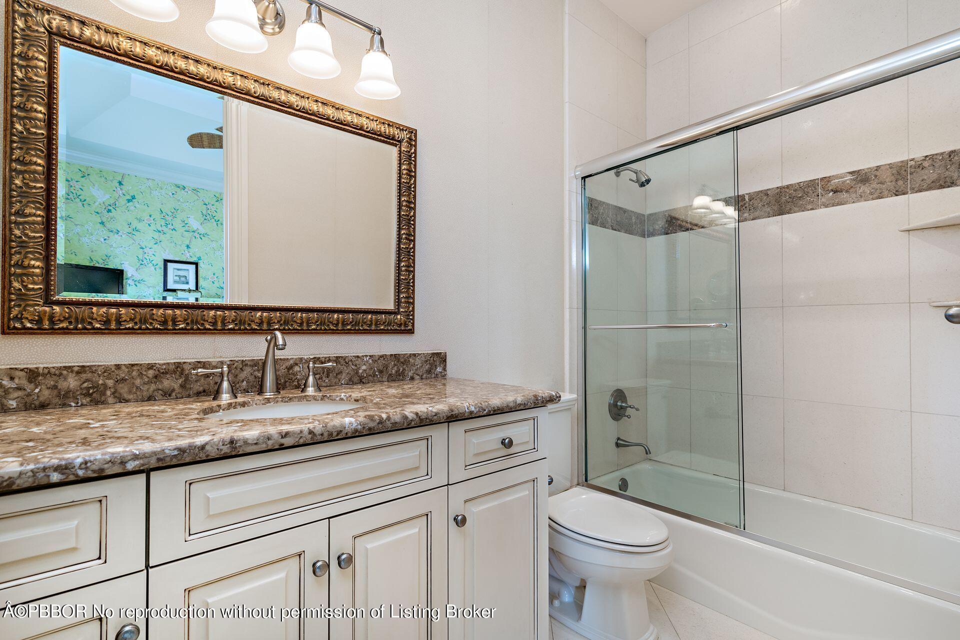 250 Country Club Road Palm Beach, FL 33480 - Photo 24 of 33 a bathroom with a granite countertop sink toilet and shower