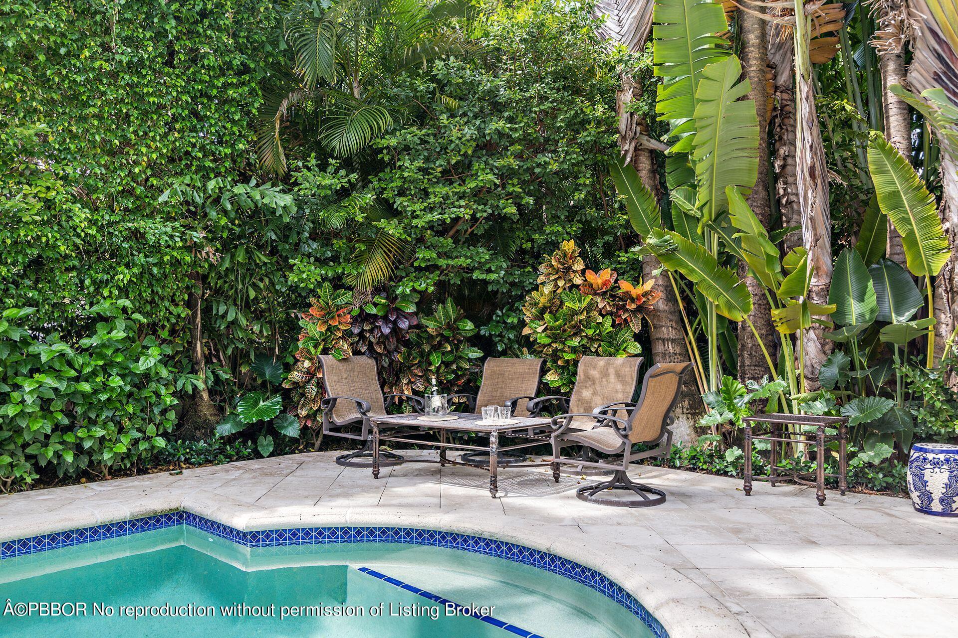 250 Country Club Road Palm Beach, FL 33480 - Photo 30 of 33 a view of a backyard with a patio