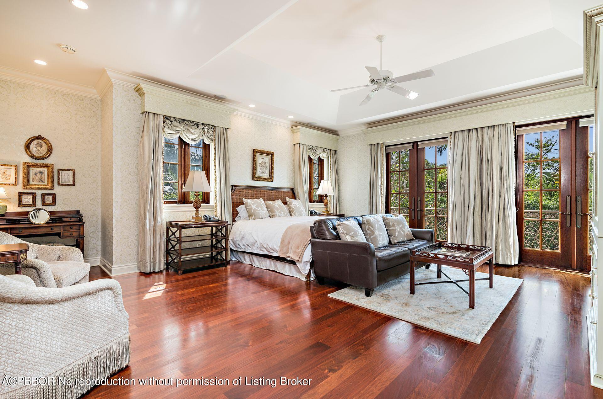 250 Country Club Road Palm Beach, FL 33480 - Photo 7 of 33 a bedroom with furniture and a large window