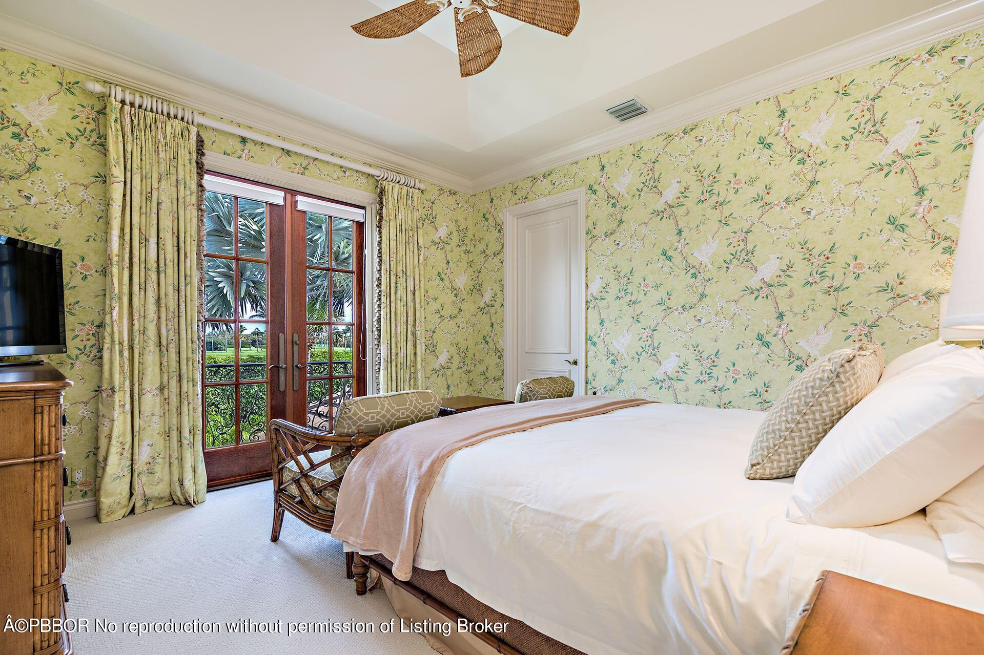 250 Country Club Road Palm Beach, FL 33480 - Photo 8 of 33 a bedroom with a bed and a flat tv screen