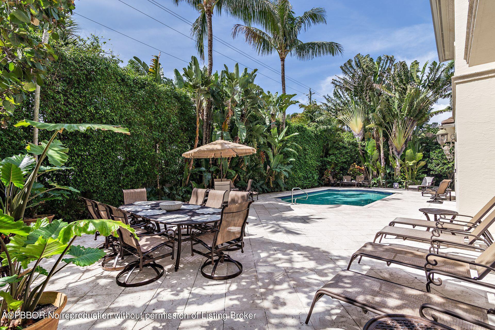 250 Country Club Road Palm Beach, FL 33480 - Photo 9 of 33 a view of a backyard with sitting area