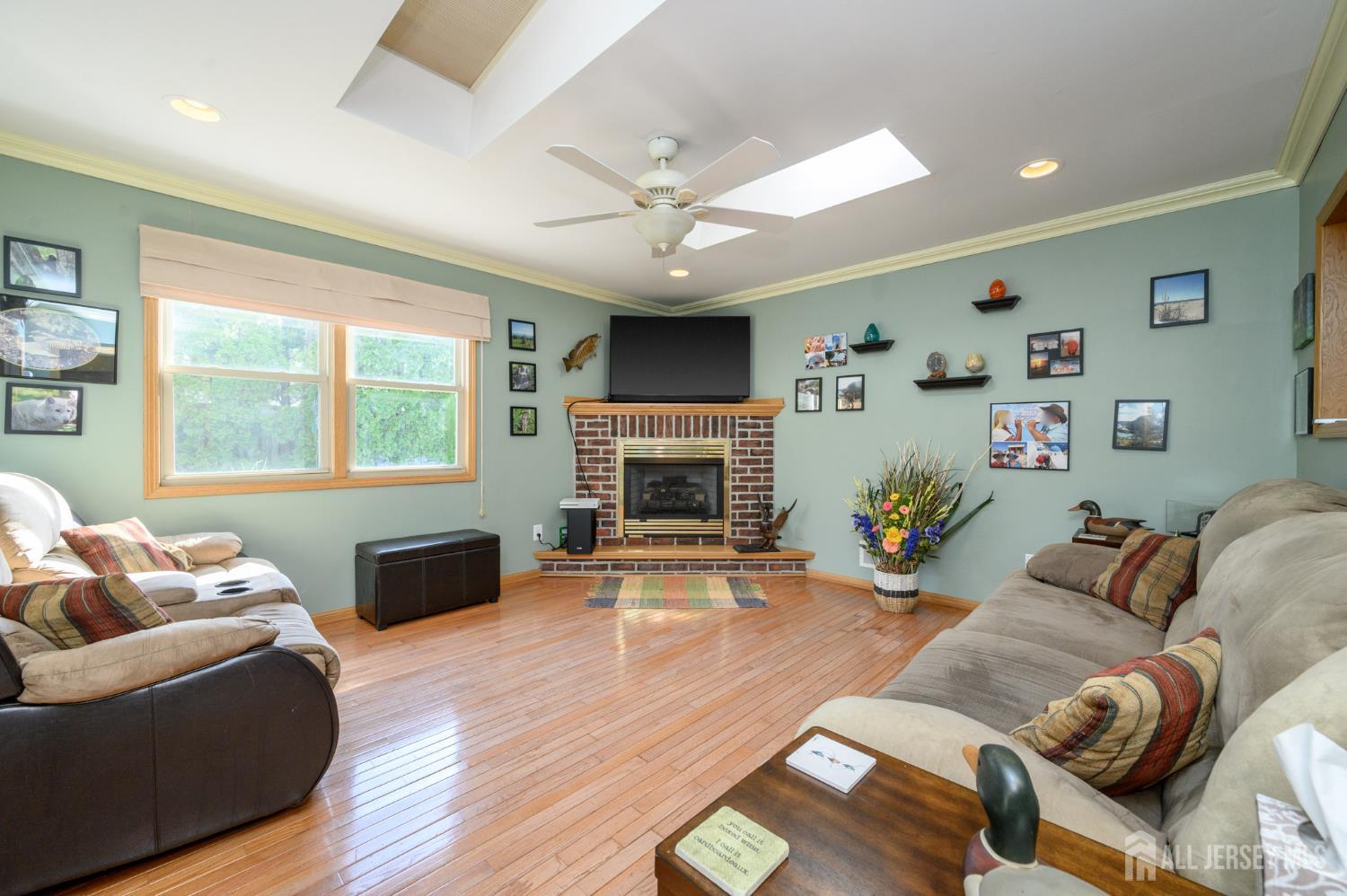 10 Eric Drive Howell, NJ 07731 - Photo 12 of 43 a living room with furniture and a fireplace