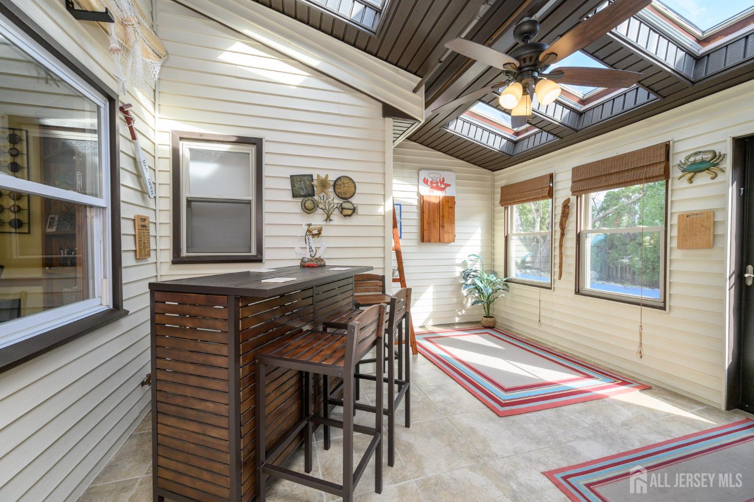 10 Eric Drive Howell, NJ 07731 - Photo 15 of 43 a balcony with furniture and a potted plant