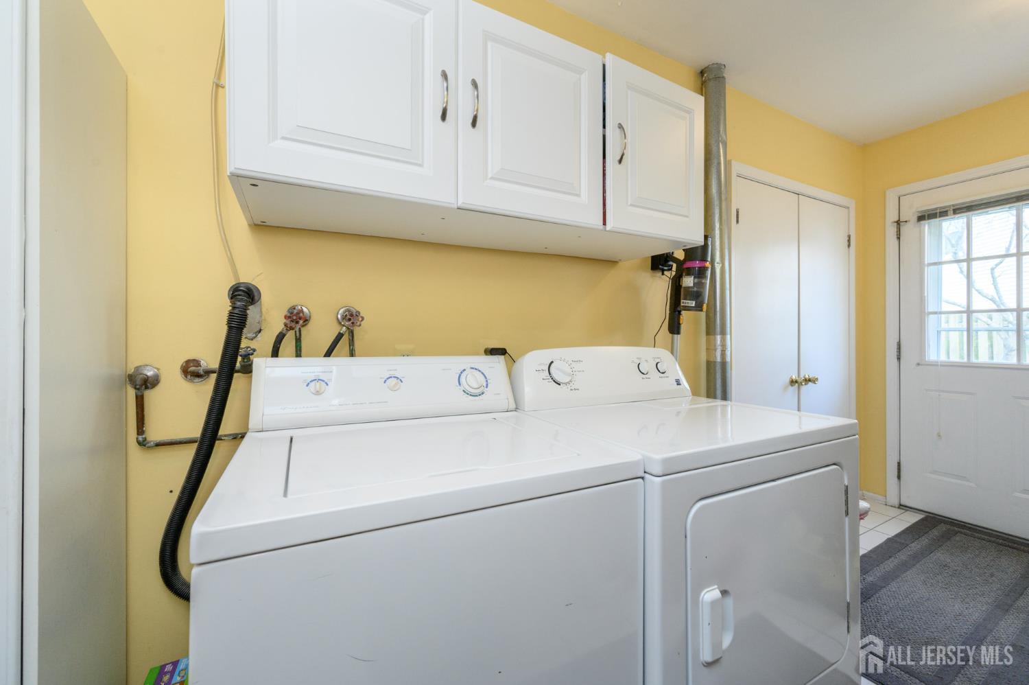 10 Eric Drive Howell, NJ 07731 - Photo 23 of 43 a utility room with dryer and washer