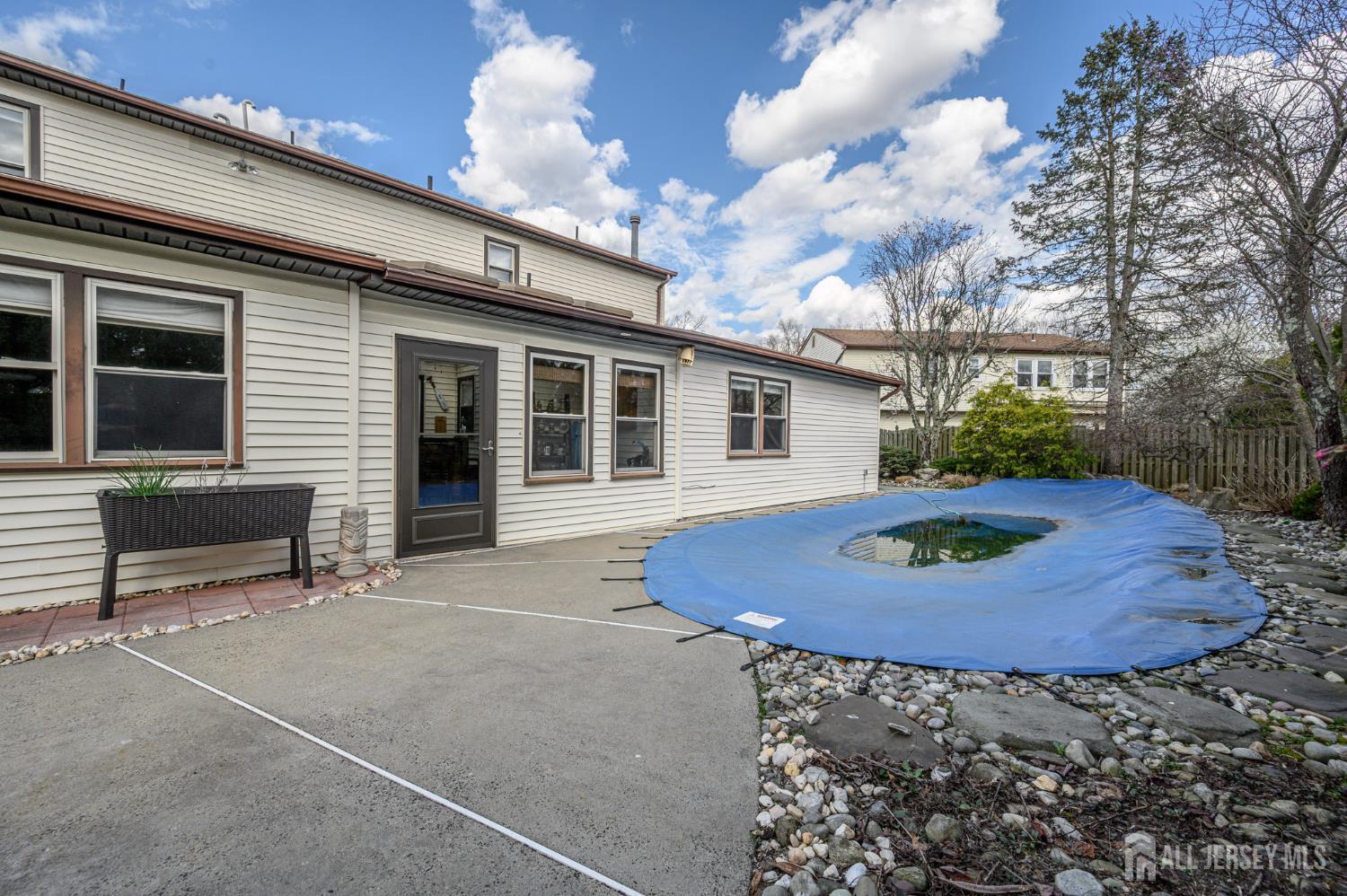 10 Eric Drive Howell, NJ 07731 - Photo 38 of 43 a view of a house with backyard and sitting area