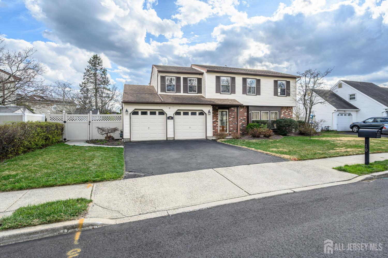 10 Eric Drive Howell, NJ 07731 - Photo 43 of 43 a front view of a house with a yard and garage