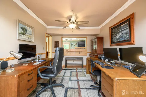 a workspace with furniture and a fireplace