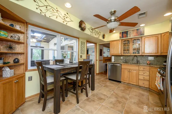 a kitchen with a table and chairs in it
