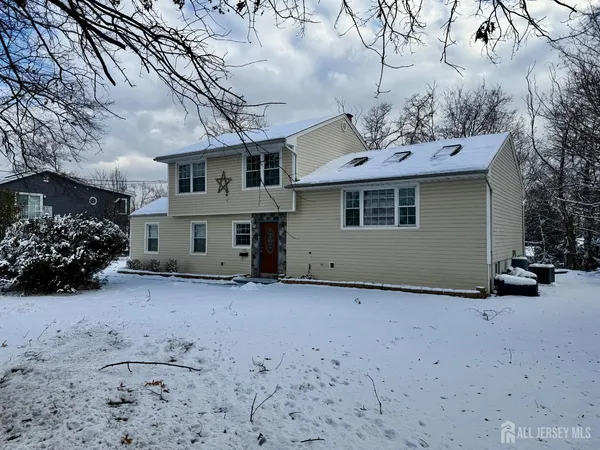 a view of a house with a snow in the yard
