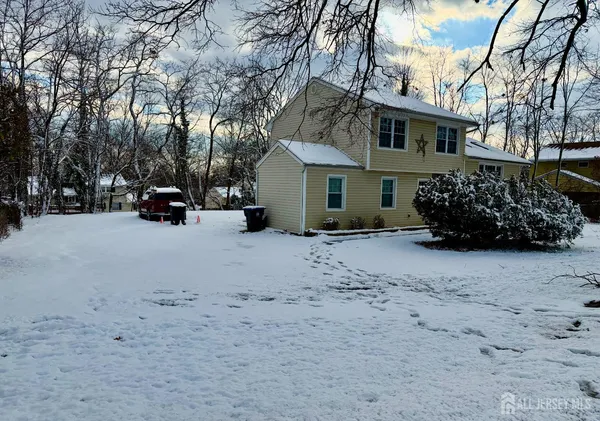 a view of a house with a snow in front of house