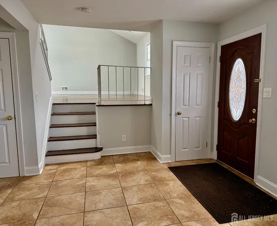 a view of entryway with stairs