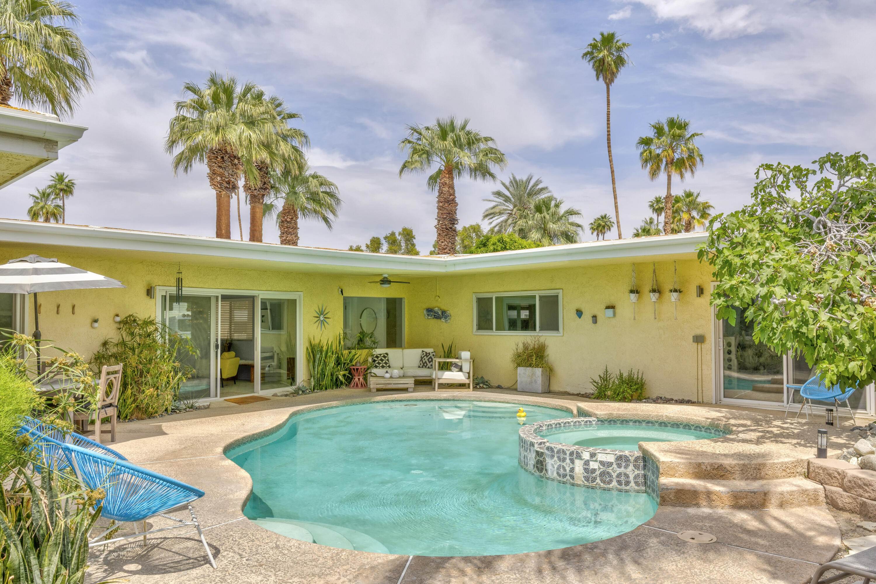 74533 Peppertree Drive Palm Desert, CA 92260 - Photo 1 of 34 swimming pool with outdoor seating