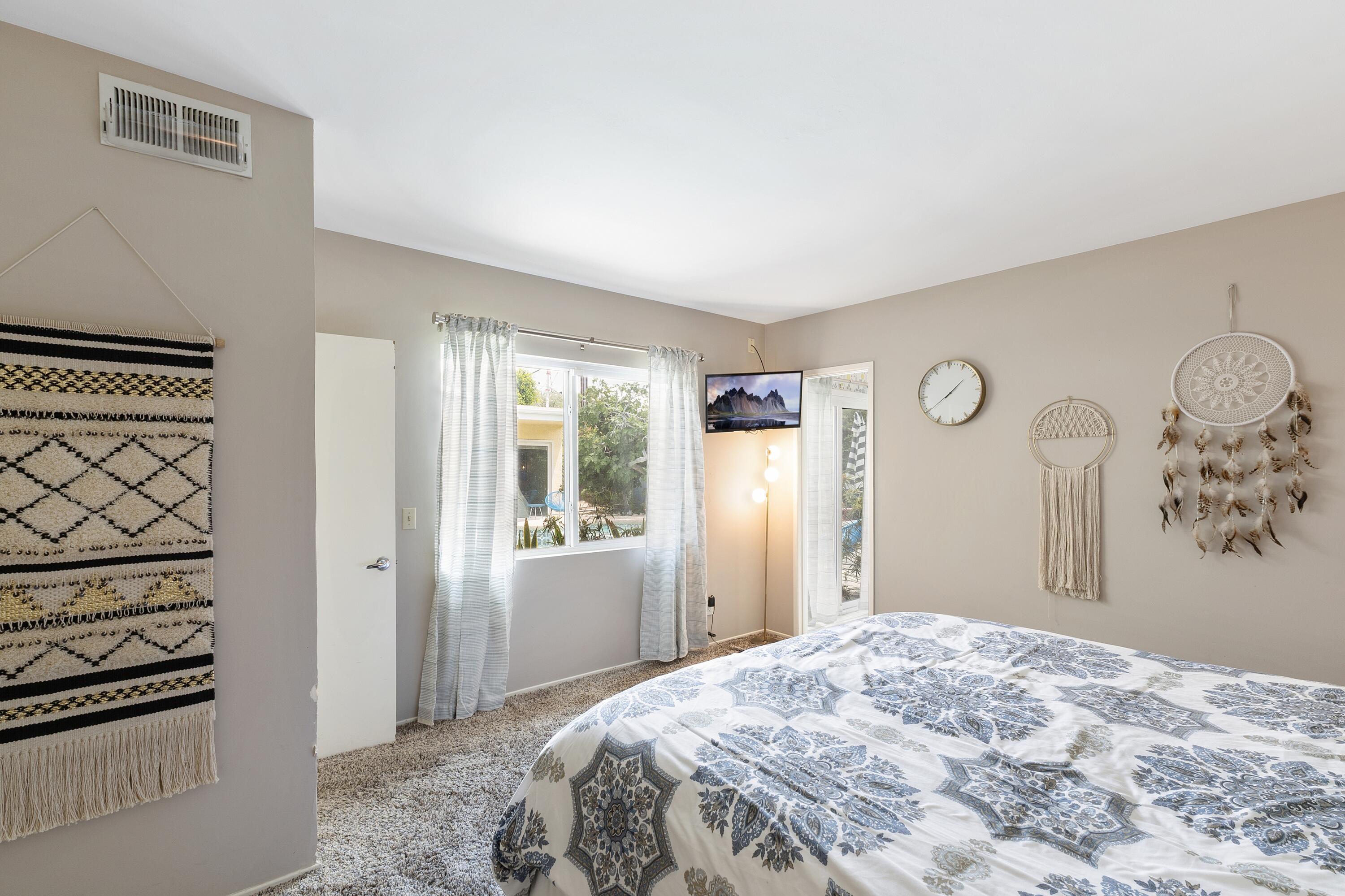 74533 Peppertree Drive Palm Desert, CA 92260 - Photo 17 of 34 a bedroom with a bed and a window